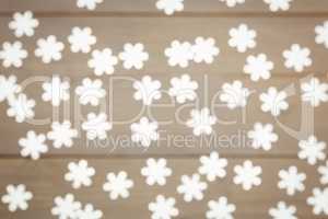 Snowflake christmas decoration scattered on wooden table