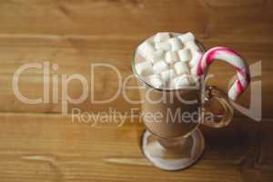 Cup of coffee with marshmallow and candy cane