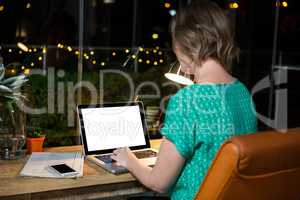 Businesswoman working on laptop