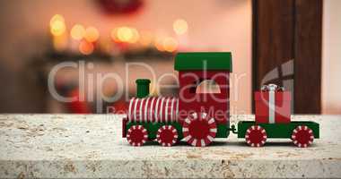 Composite image of train set with gift box