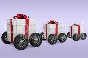 Composite image of gift box with red ribbon on wheels