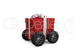 Gift box wrapped in red paper with ribbon on wheels
