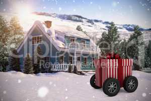 Composite image of striped white and red gift box with wheels