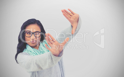 Composite image of asian woman making square with hands