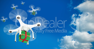 Composite image of quadcopter with gift box