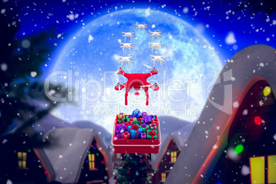 Composite image of mini drone pulling chirstmas sledge