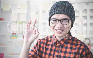 Composite image of smiling hipster making ok sign