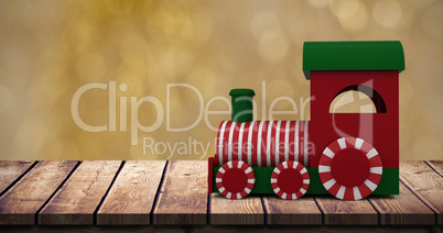 Composite image of steam engine toy model with striped