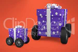 Composite image of gift box with gray ribbon on wheels
