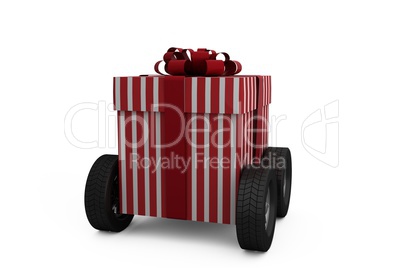 Striped red and white gift box on wheels