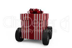 Striped red and white gift box on wheels