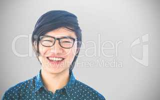 Composite image of smiling hipster businessman looking at camera