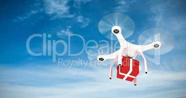 Composite image of digitally generated image of quadcopter with red gift box