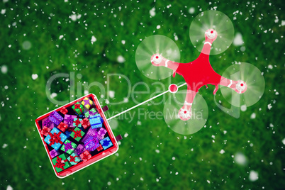 Composite image of overhead view of drone pulling chirstmas sledge