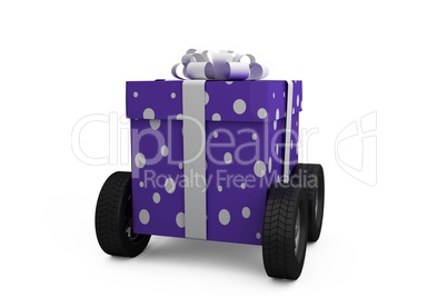 Gift box with gray ribbon on wheels