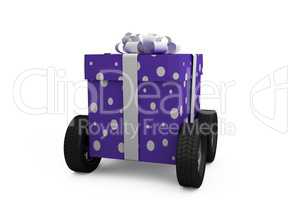 Gift box with gray ribbon on wheels