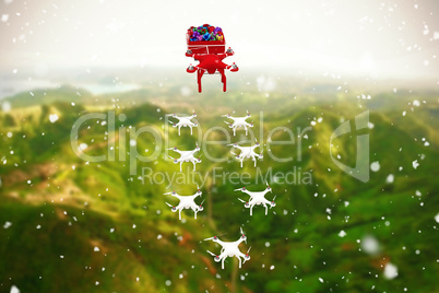 Composite image of high angle view of mini drone pulling chirstmas sledge with gift