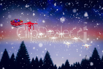 Composite image of high angle view of mini drone pulling chirstmas sledge