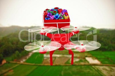 Composite image of high angle view of drone pulling chirstmas sledge