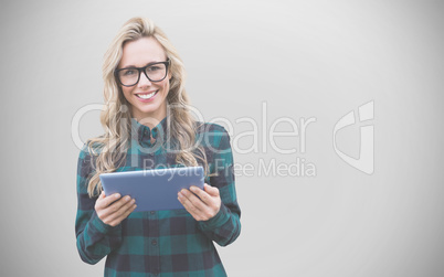 Composite image of pretty blonde with tablet