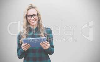 Composite image of pretty blonde with tablet