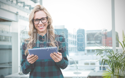 Composite image of pretty blonde with tablet