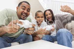 African American Family Having Fun Playing Computer Console Game