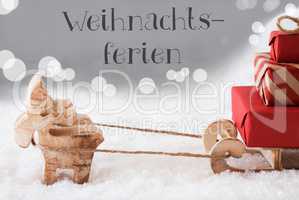 Reindeer With Sled, Silver Background, Weihnachtsferien Means Christmas Break