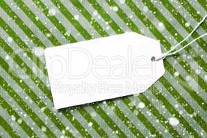 Label On Green Wrapping Paper And Copy Space, Snowflakes