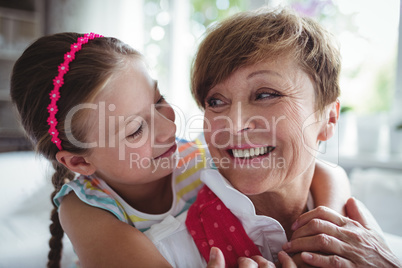 Granddaughter embracing her grandmother