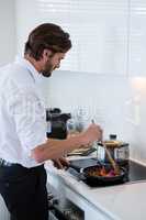 Man preparing a food in kitchen