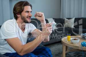 Man playing video games in living room