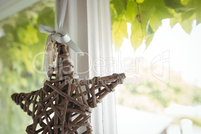 Wicker star hanging on a window