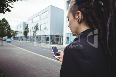 Businesswoman using mobile phone