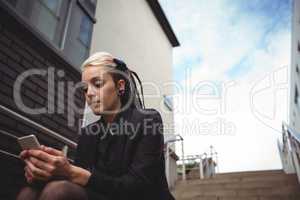 Businesswoman using mobile phone