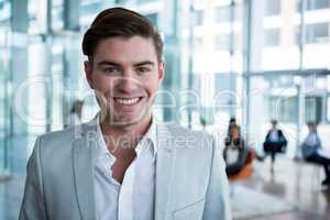 Smiling businessman in office