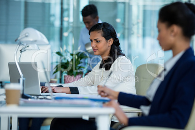 Businesswoman working on laptop