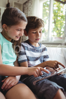 Children using digital tablet