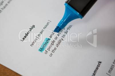 Close-up of marker pen highlighting text