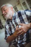 Senior man suffering from chest pain