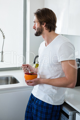 Man having breakfast in kitchen