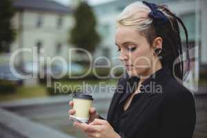 Businesswoman using mobile phone