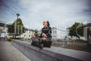 Businesswoman practicing yoga