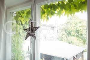 Wicker star hanging on a window