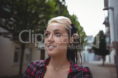 Portrait of woman standing in street