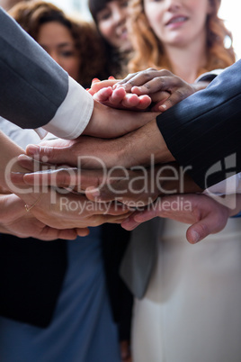 Businesspeople with hand stacked