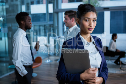 Portrait of beautiful businesswoman holding laptop Portrait of beautiful businesswoman holding laptop
