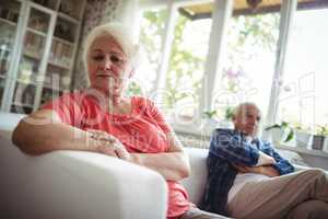 Upset senior couple ignoring each other