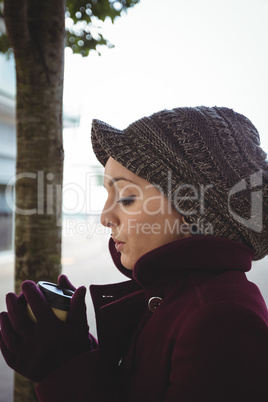 Woman holding a cup of coffee