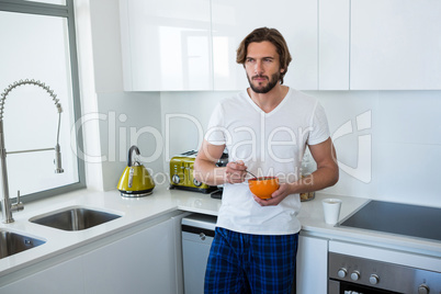 Man having breakfast in kitchen